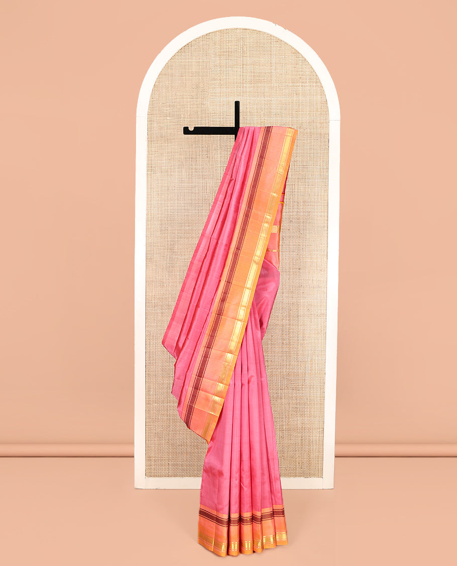 Pink Plain Kanchipuram Silk Saree, Complemented by a Contrast One-Sided Rettai Pettu Mayil Kann Border, Zari Striped Pallu, and No Blouse