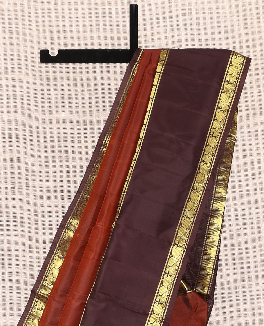 Dark Rust Plain Kanchipuram Silk Saree, a Contrast Rettai Pettu Border of Thazampoo Rekku, Mayil, and Maga Designs, Zari Striped Pallu, and a Contrast Blouse