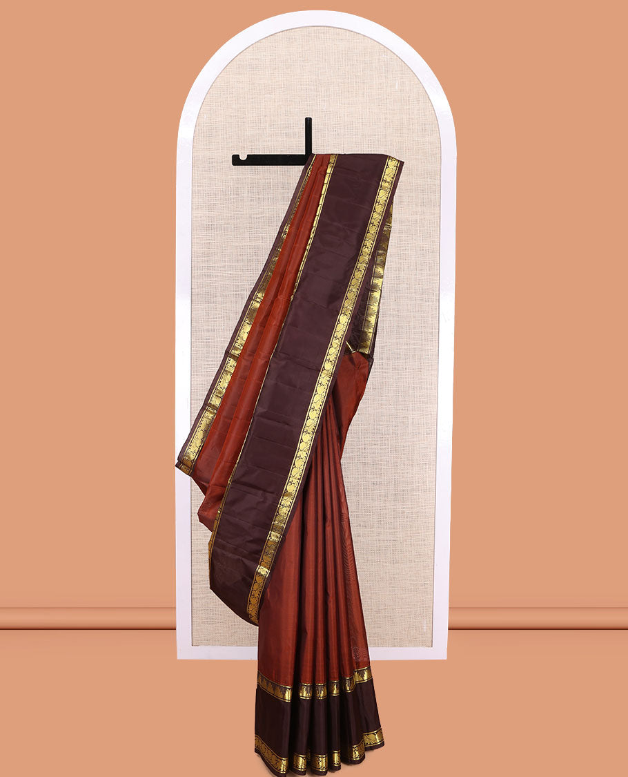 Dark Rust Plain Kanchipuram Silk Saree, a Contrast Rettai Pettu Border of Thazampoo Rekku, Mayil, and Maga Designs, Zari Striped Pallu, and a Contrast Blouse