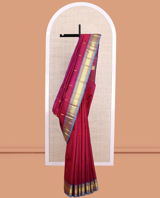 Maroon Kanchipuram Silk Saree, Elevated with Zari Buttas, a Contrast One-Sided Border of Paneer Sombu, Banaras, Muthu, and Mayil Kann Design, Zari Design Pallu, and No Blouse