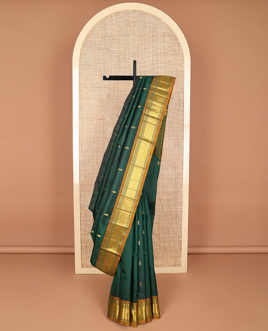 Bottle green buttas kancheepuram silk saree with contrast border of thilakam, mokku, banaras, kuyil kann design border & zari design pallu