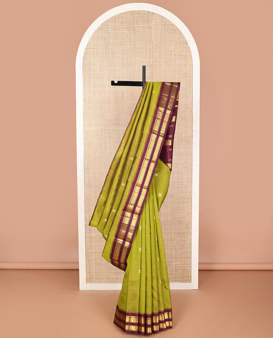 Green floral buttas kancheepuram silk saree with contrast korvai border of thilakam mokku, banaras, checked design & zari design pallu