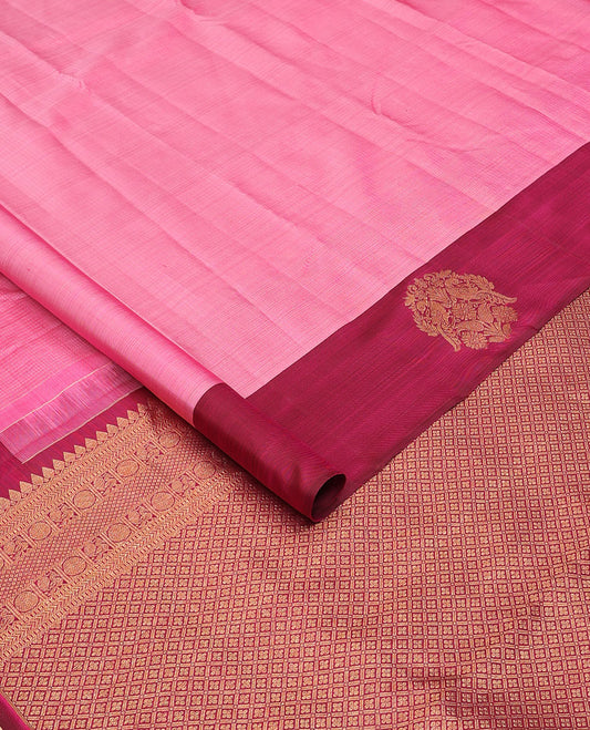 Pink zari woven Kanchipuram silk saree, contrast rettai mayil zari border, and jaal pallu