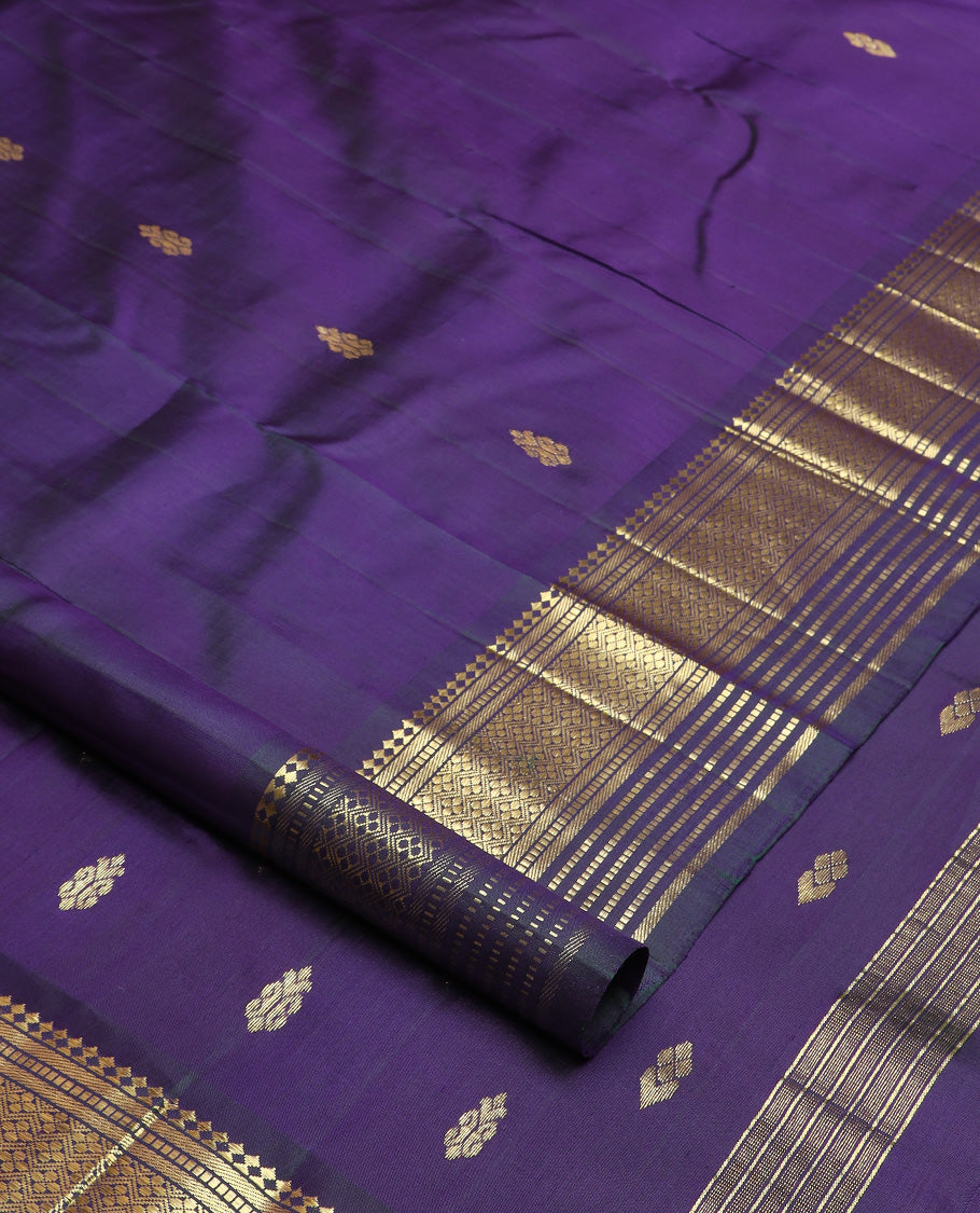 Blue zari buttas Kanchipuram silk saree, one-sided border of paneer sombu, banaras, muthu, and jaal design, and zari design pallu