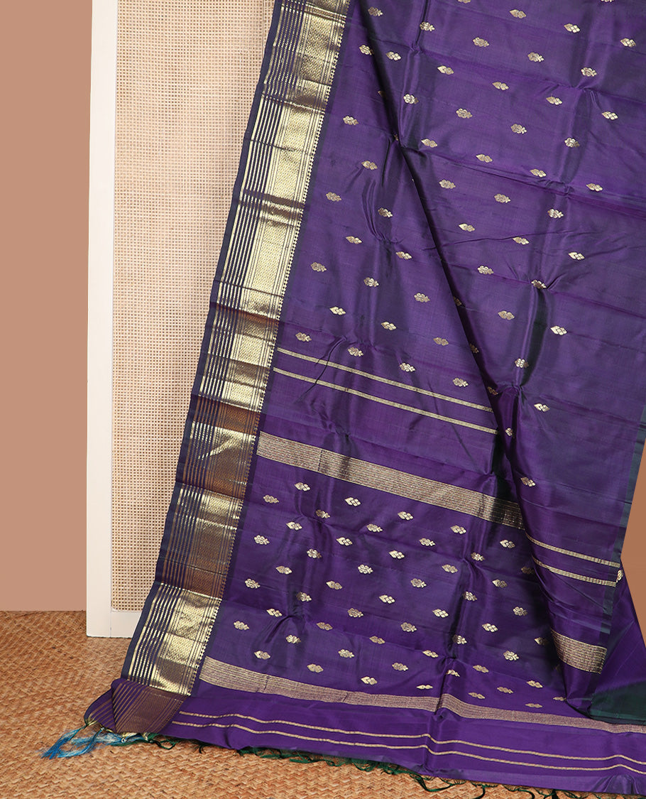 Blue zari buttas Kanchipuram silk saree, one-sided border of paneer sombu, banaras, muthu, and jaal design, and zari design pallu