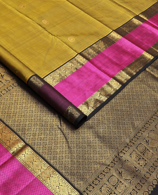 Green zari buttas Kanchipuram silk saree, contrast border of diamond, and mayil kann designs, and intricate pallu