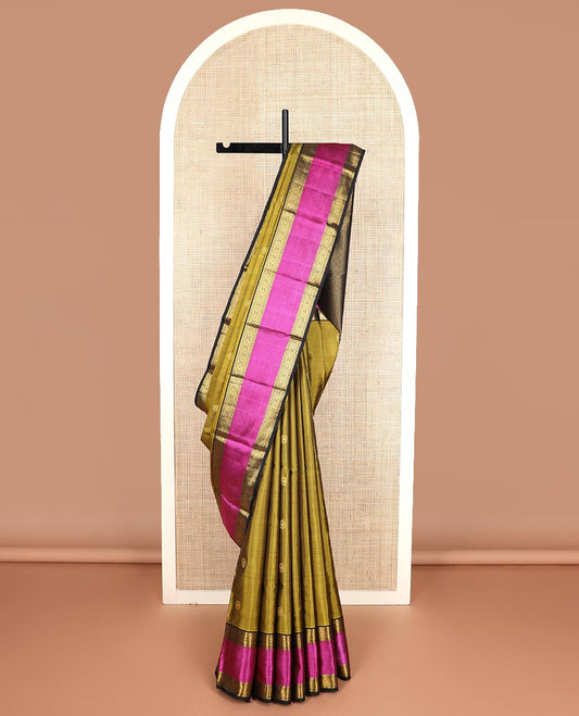 Green zari buttas Kanchipuram silk saree, contrast border of diamond, and mayil kann designs, and intricate pallu