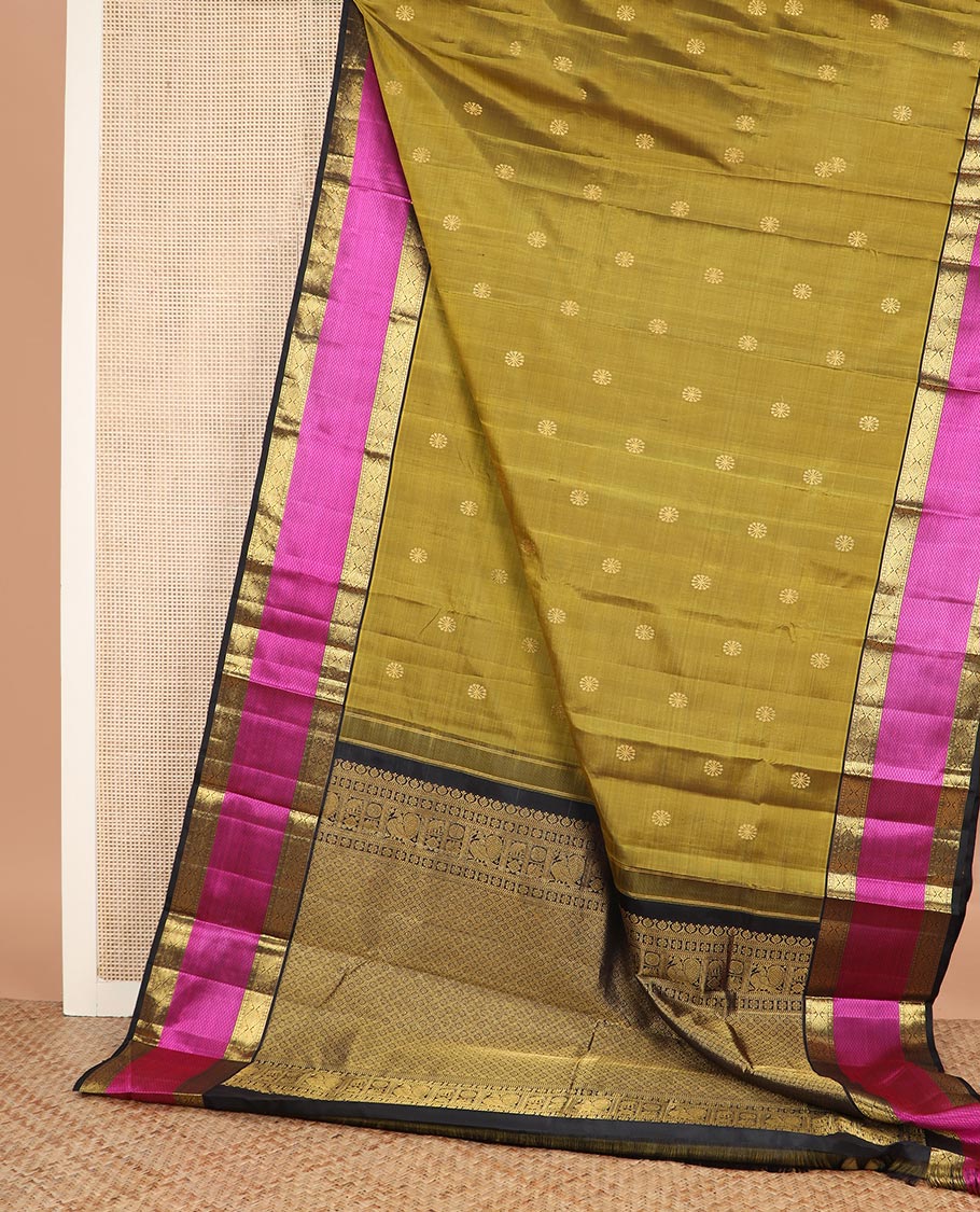 Green zari buttas Kanchipuram silk saree, contrast border of diamond, and mayil kann designs, and intricate pallu