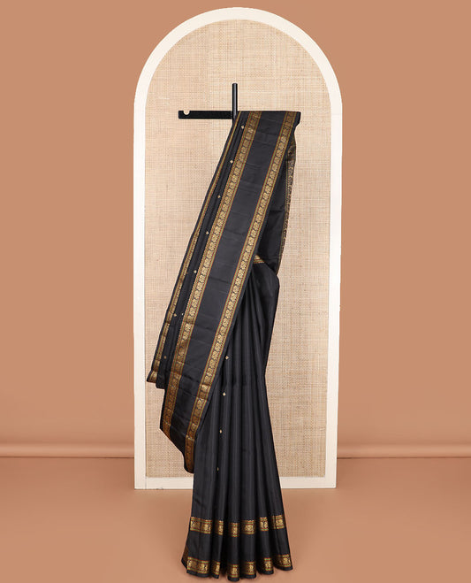 Black buttas Kanchipuram silk saree, rettai pettu border of rekku, muthu, and mayil designs, and jaal pallu