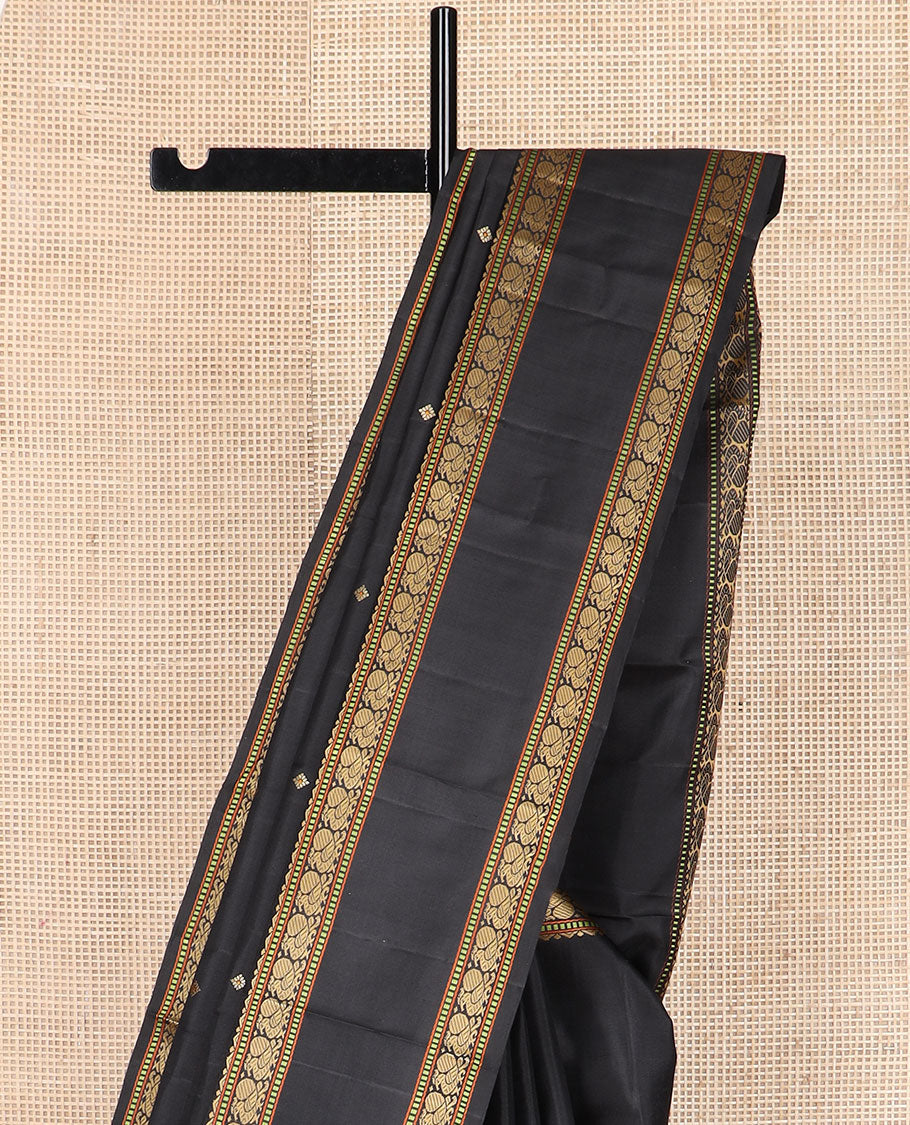 Black buttas Kanchipuram silk saree, rettai pettu border of rekku, muthu, and mayil designs, and jaal pallu