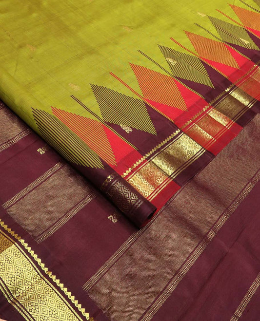 Green zari buttas Kanchipuram silk saree, contrast one-sided thazampoo rekku border of thilakam mokku, and jaal designs, and zari design pallu