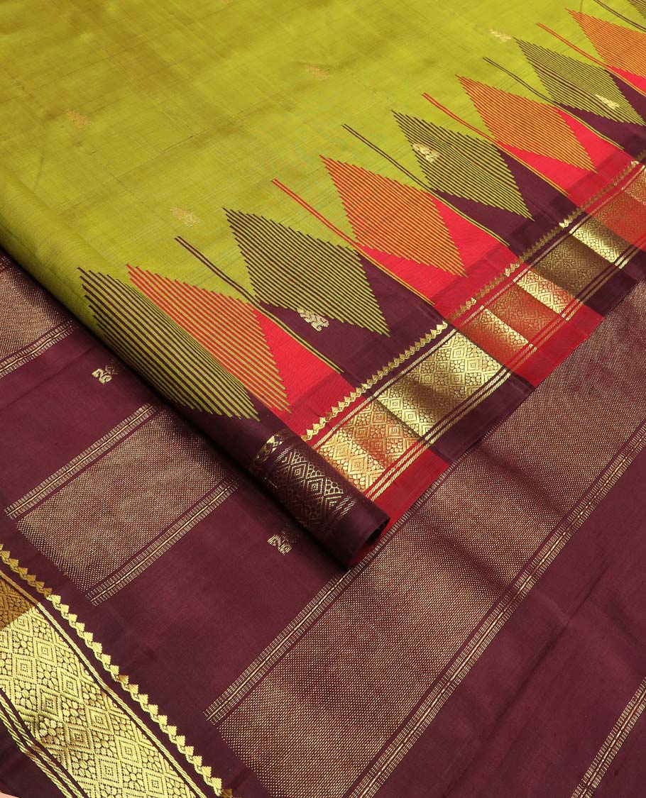 Green zari buttas Kanchipuram silk saree, contrast one-sided thazampoo rekku border of thilakam mokku, and jaal designs, and zari design pallu