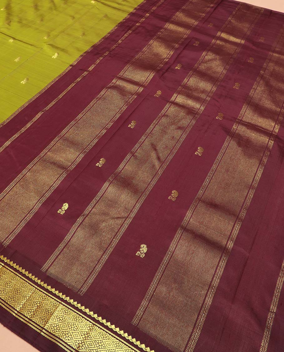Green zari buttas Kanchipuram silk saree, contrast one-sided thazampoo rekku border of thilakam mokku, and jaal designs, and zari design pallu