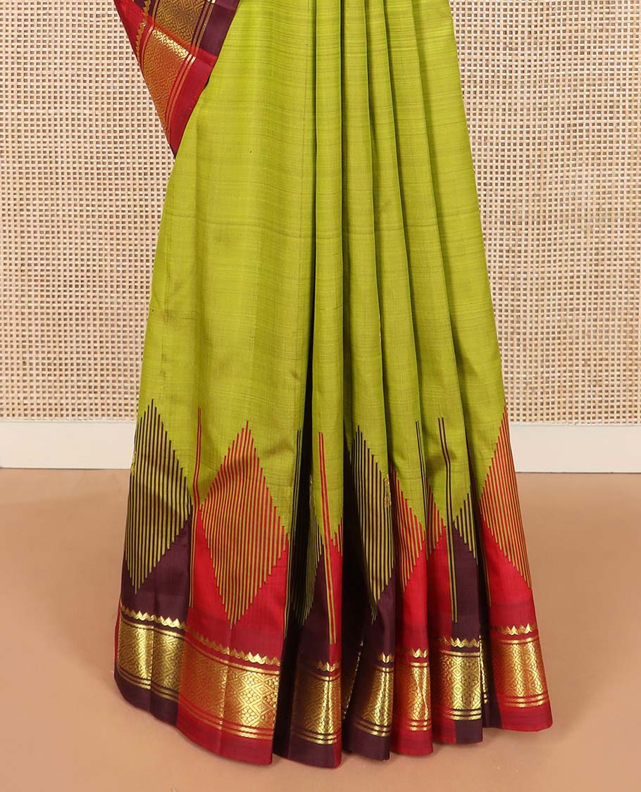 Green zari buttas Kanchipuram silk saree, contrast one-sided thazampoo rekku border of thilakam mokku, and jaal designs, and zari design pallu