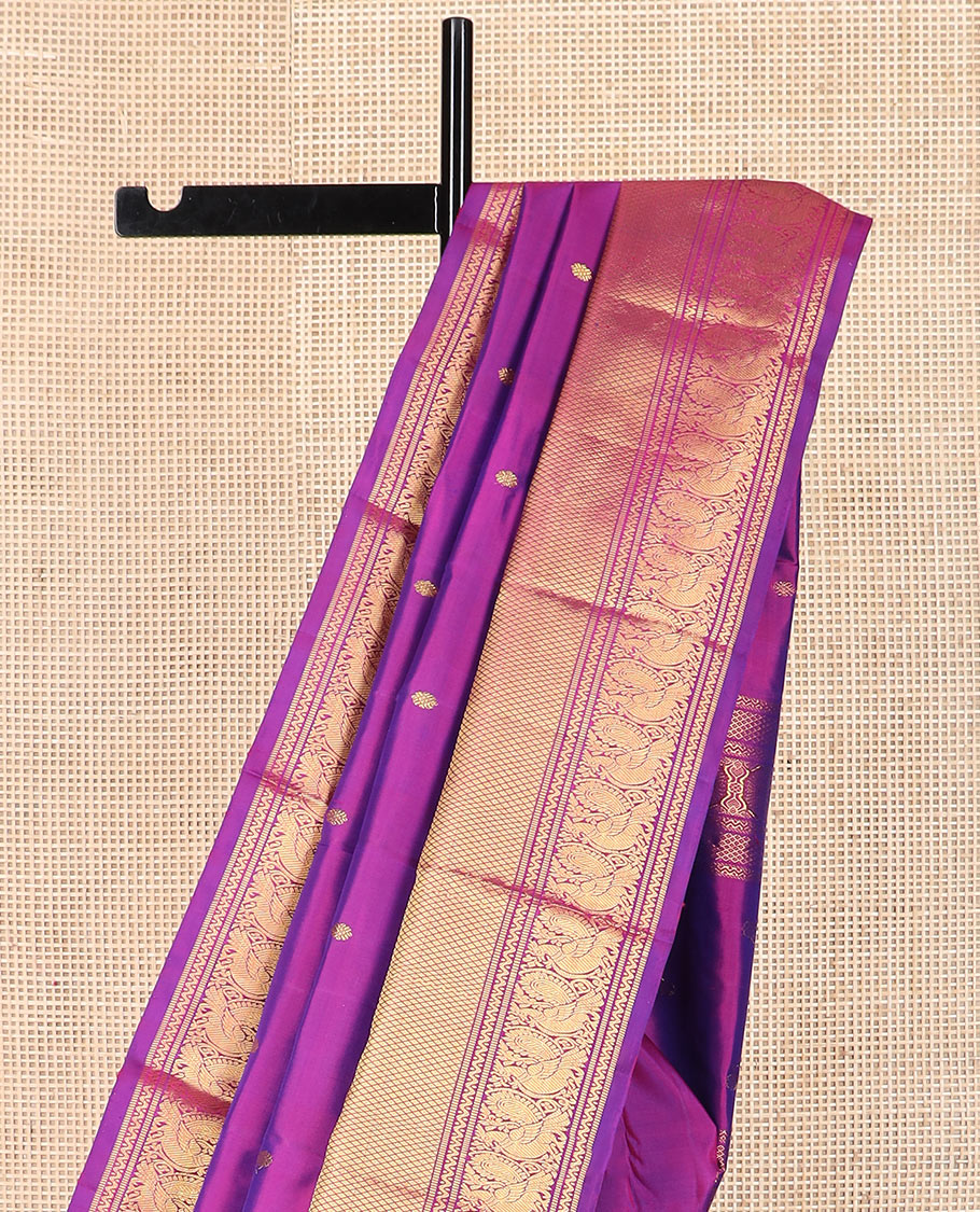 Rani pink zari buttas Kanchipuram silk saree, zari border of neli, muthu, mayil kann, and mayil designs, and pallu of traditional designs