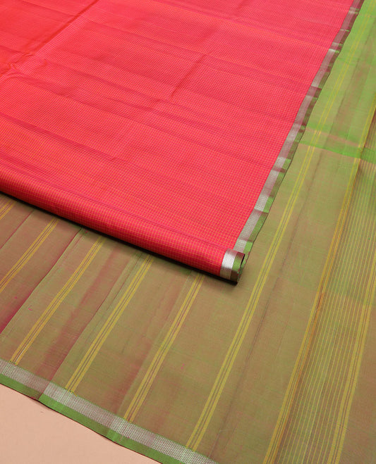 Red micro-checked Kanchipuram silk saree, contrast piping zari border of vanki designs, and striped pallu