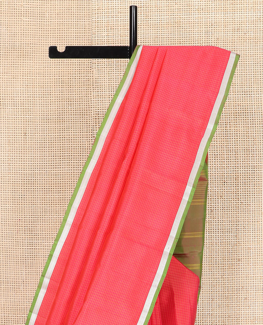 Red micro-checked Kanchipuram silk saree, contrast piping zari border of vanki designs, and striped pallu