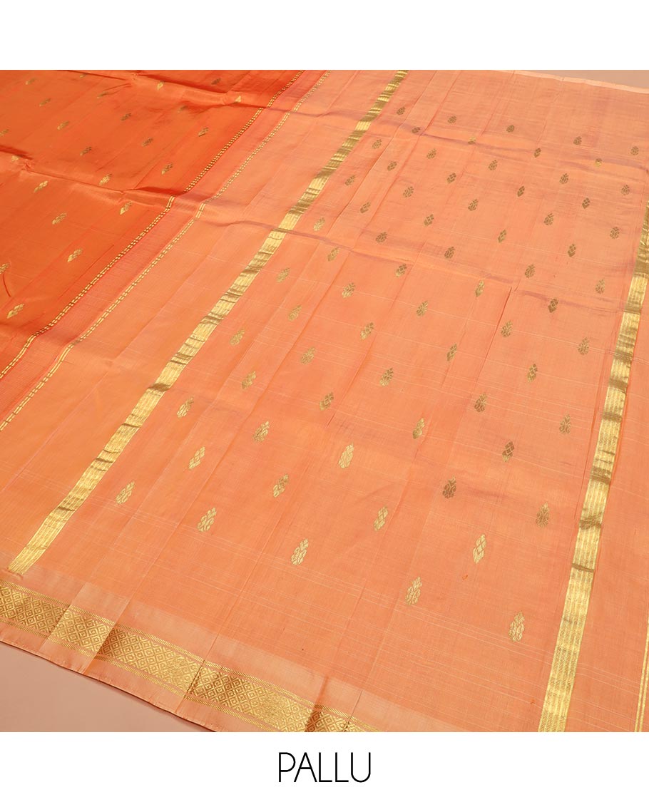 Orange Kanchipuram Silk Saree Beautified with Zari Buttas All Over Its Body, Complemented by a Contrast One-Sided Border of Banaras, and Mayil Kann Designs, Pallu of Zari Stripes, and Comes Without a Blouse