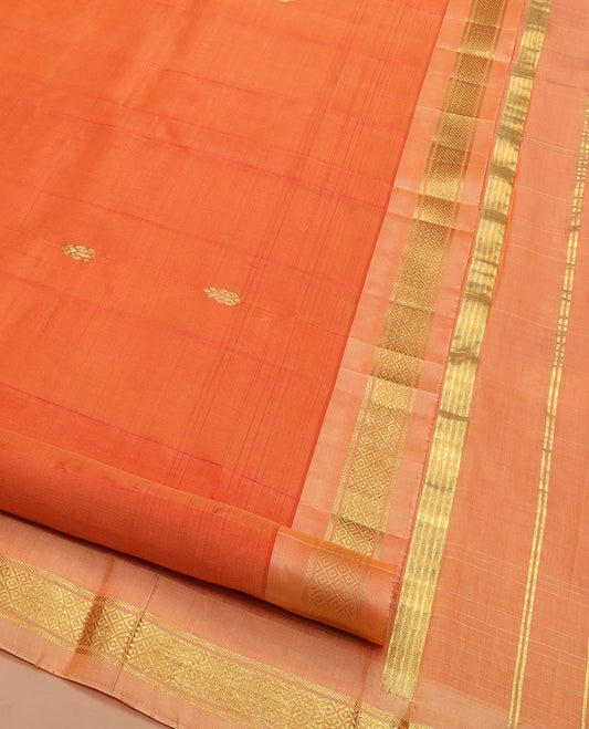 Orange Kanchipuram Silk Saree Beautified with Zari Buttas All Over Its Body, Complemented by a Contrast One-Sided Border of Banaras, and Mayil Kann Designs, Pallu of Zari Stripes, and Comes Without a Blouse