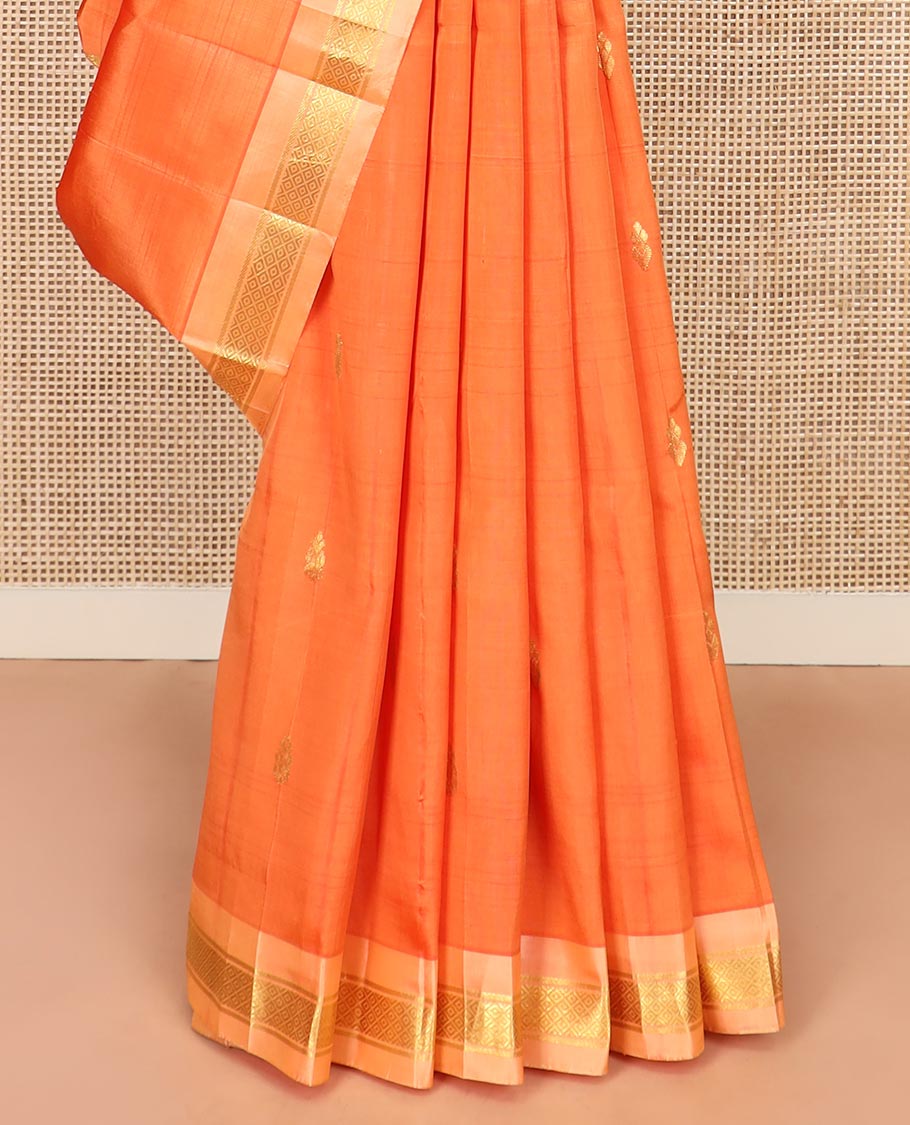 Orange Kanchipuram Silk Saree Beautified with Zari Buttas All Over Its Body, Complemented by a Contrast One-Sided Border of Banaras, and Mayil Kann Designs, Pallu of Zari Stripes, and Comes Without a Blouse