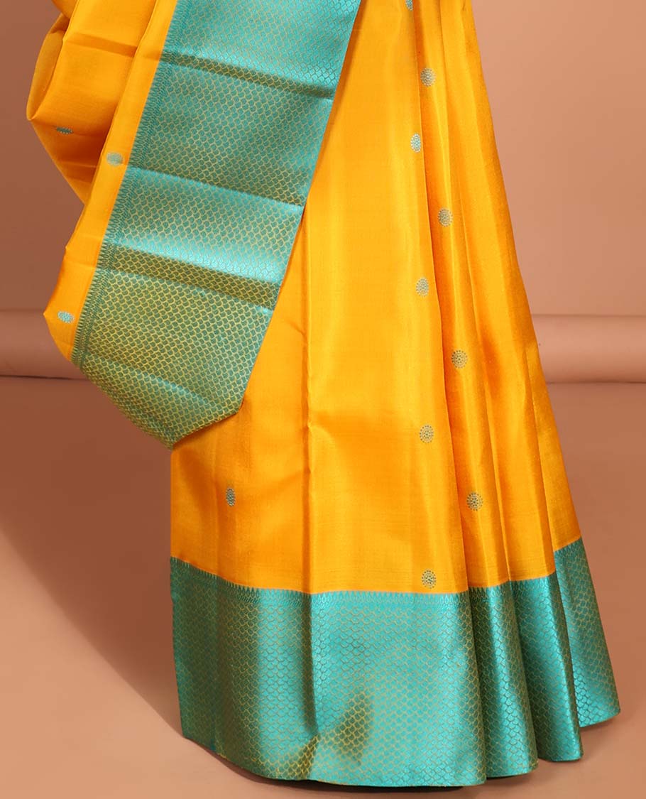 Yellow round buttas kancheepuram silk sare with contrast argyle border & intricate zari pallu