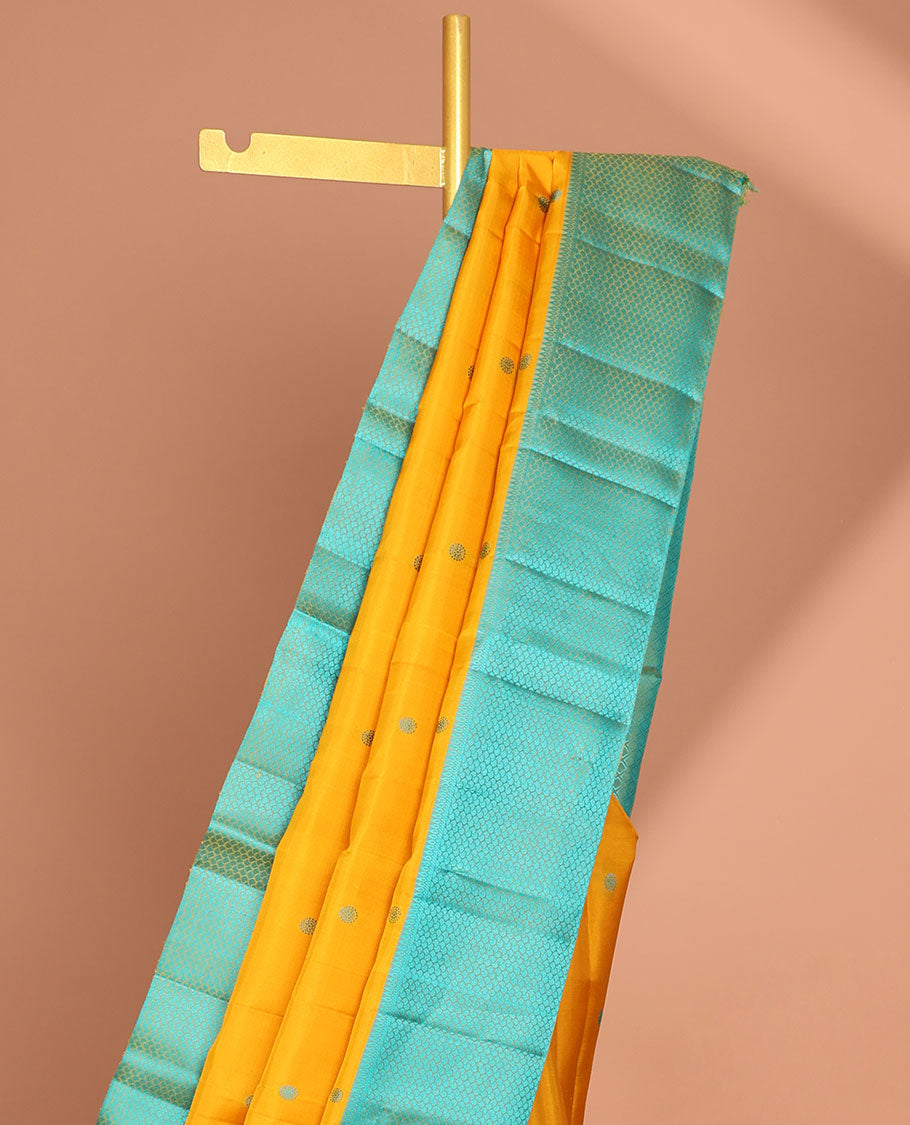 Yellow round buttas kancheepuram silk sare with contrast argyle border & intricate zari pallu
