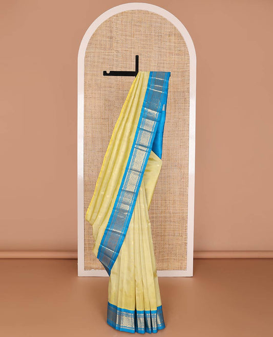 Yellow zari buttas kancheepuram silk saree, contrast one-sided korvai border of traditional designs & zari design pallu