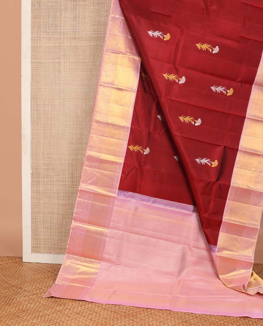 Crimson red floral buttas Kanchipuram korvai silk saree, contrast neer korvai border of thilakam mokku, muthu, kathir, and kodi visiry designs, and zari woven pallu