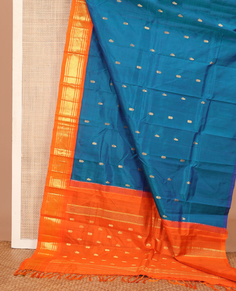 Blue zari buttas Kanchipuram silk saree, contrast one-sided korvai border of rekku, banaras, and mayil kann, and zari design pallu