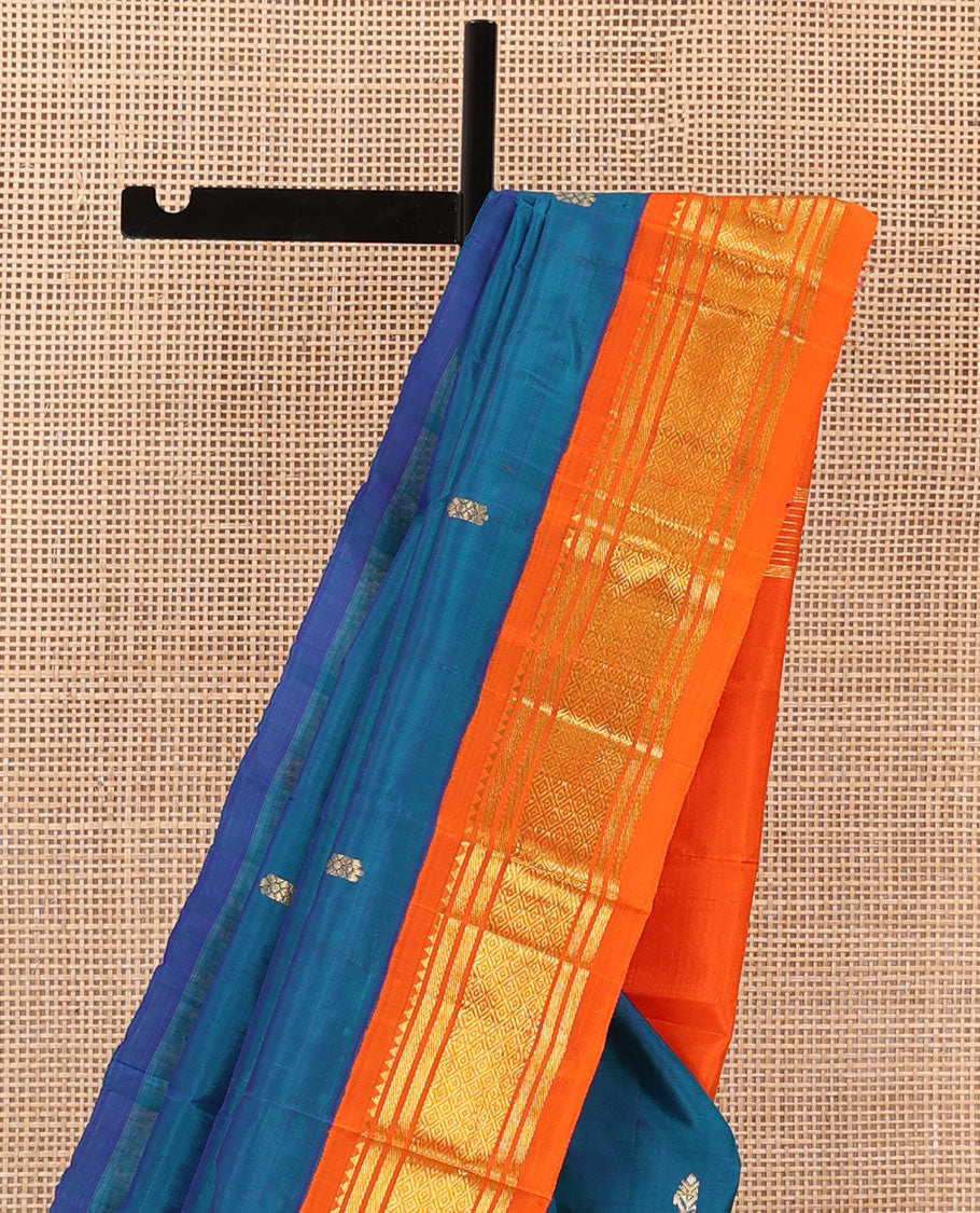 Blue zari buttas Kanchipuram silk saree, contrast one-sided korvai border of rekku, banaras, and mayil kann, and zari design pallu
