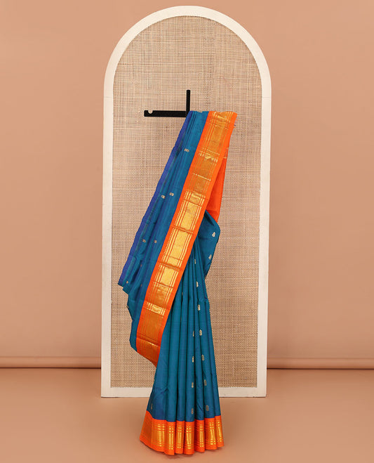 Blue zari buttas Kanchipuram silk saree, contrast one-sided korvai border of rekku, banaras, and mayil kann, and zari design pallu