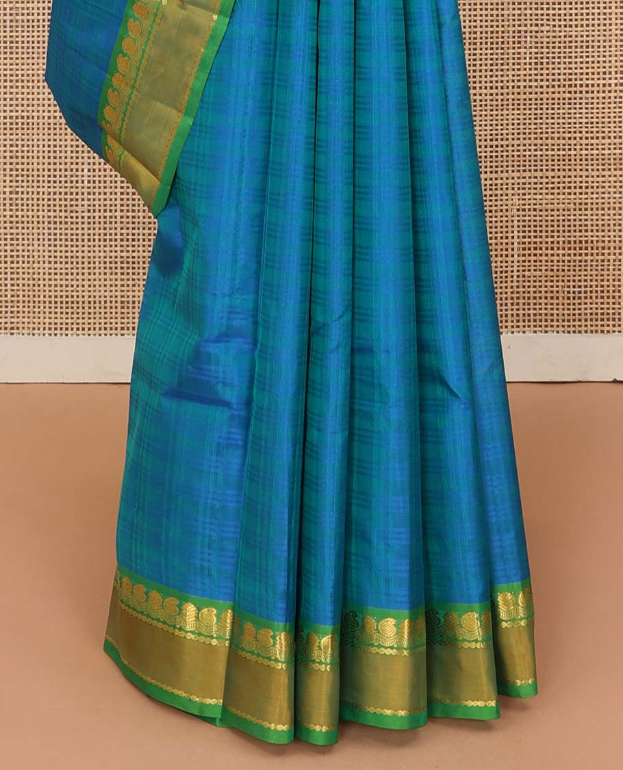 Blue checked Kanchipuram silk saree, contrast rettai pettu border of manga, neli, and diamond designs, and striped pallu