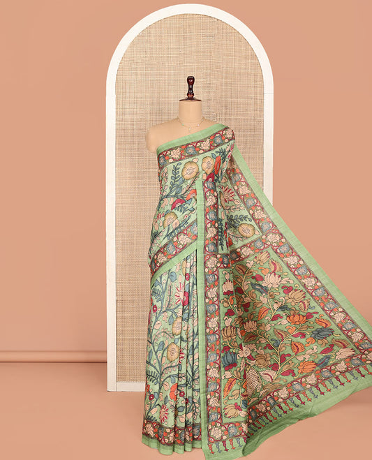 Pista Green Semi-Tussar Saree Colorfully Highlighted with Kalamkari-Style Floral Vine Print, Self-Colored Printed Border of Floral Print, Pallu Depicting Kalamkari Floral-Peacock Print, and Paired with a Matching Blouse