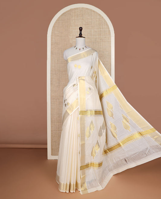 Cream pine tree zari buttas Kerala saree, traditional zari border, and pallu of pine tree motifs