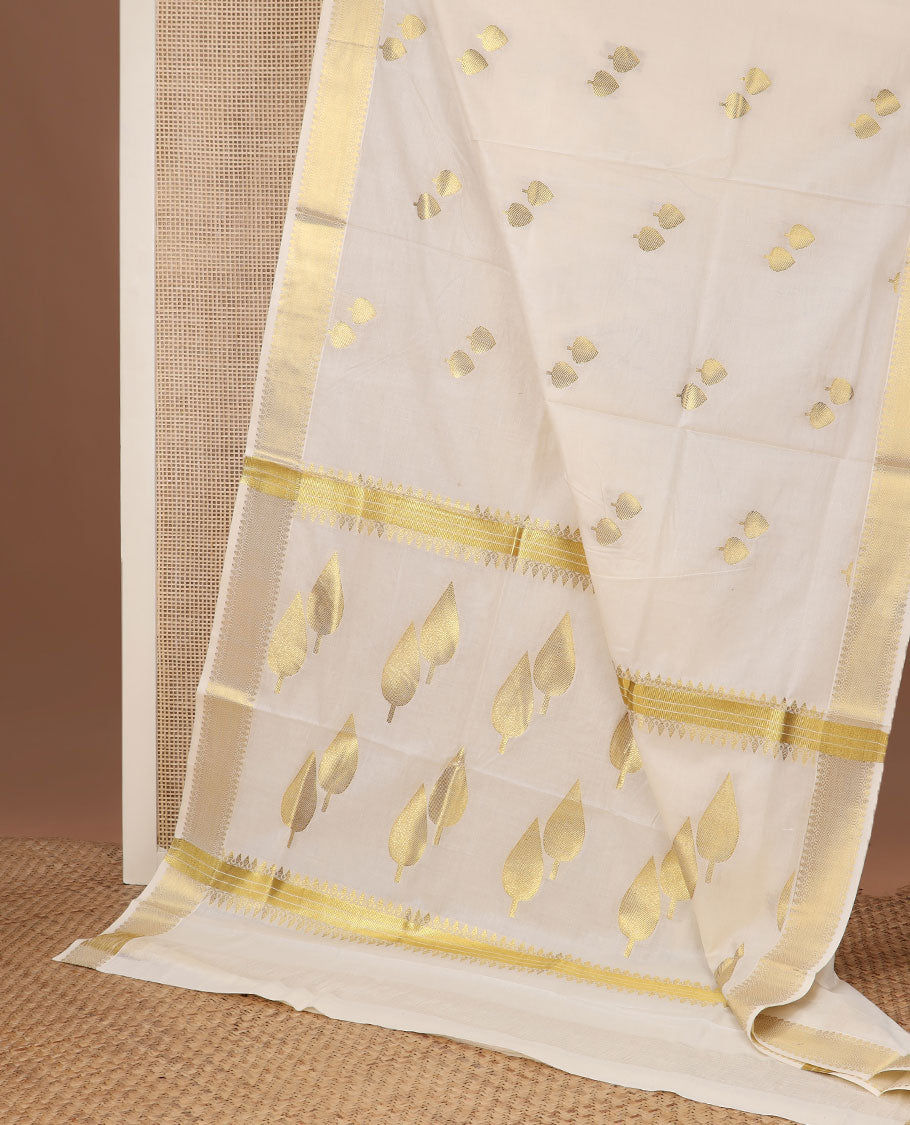 Cream pine tree zari buttas Kerala saree, traditional zari border, and pallu of pine tree motifs