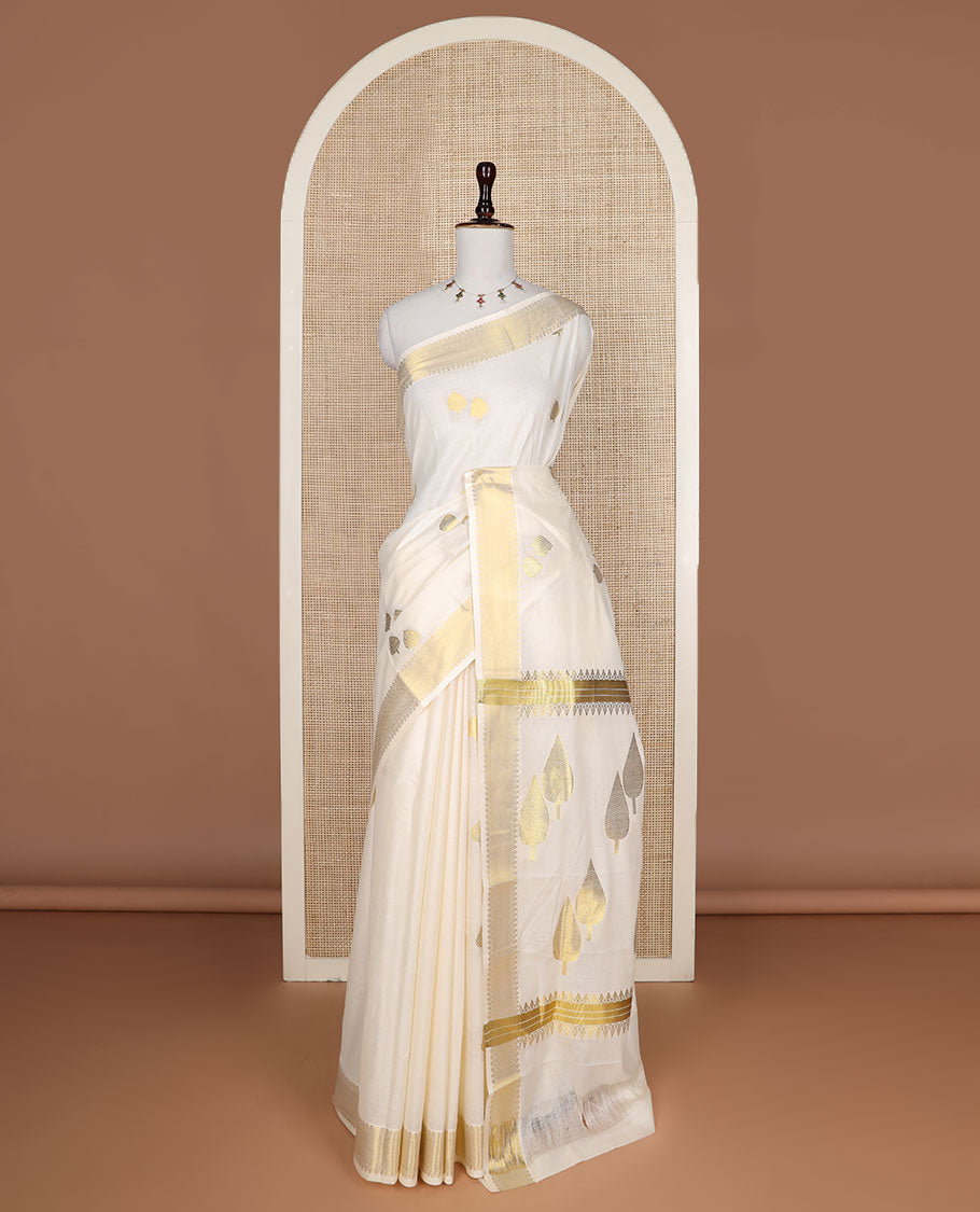 Cream pine tree zari buttas Kerala saree, traditional zari border, and pallu of pine tree motifs