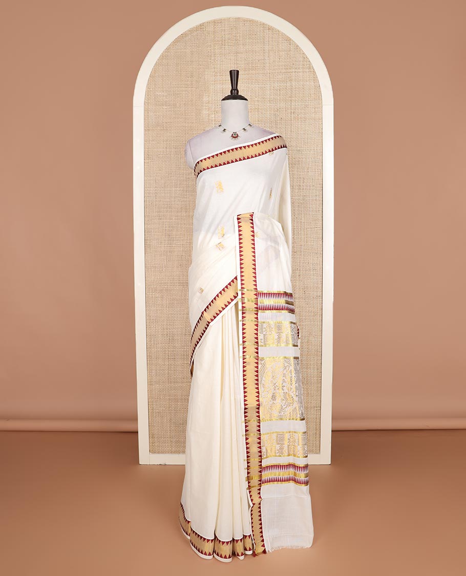 Cream gold zari buttas Kerala cotton saree, zari temple border, and pallu of intricate zari designs