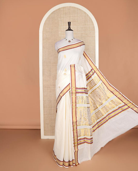 Cream gold zari buttas Kerala cotton saree, zari temple border, and pallu of intricate zari designs