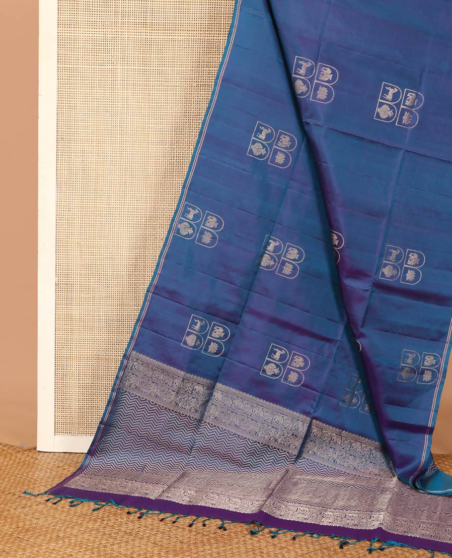 Borderless blue kuthirai, kamalam, yaanai, and Kumbha enclosed Mughal arches soft silk saree, pallu of chevron designs
