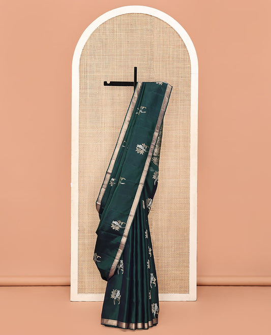 Green Mayuri Soft Silk Saree, Bedecked with Bird Buttas All Over Its Body, Highlighted by Zari Piping Border, Pallu of Floral Jaal and Bird Designs, and Paired with a Matching Blouse