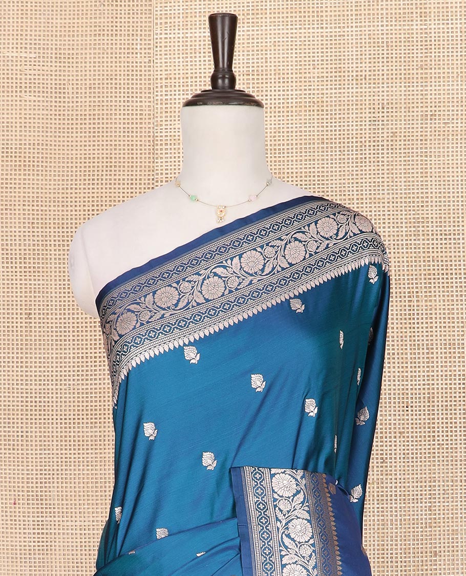 Blue floral buttas mushru silk saree, floral-creeper design zari border, and jaal pallu