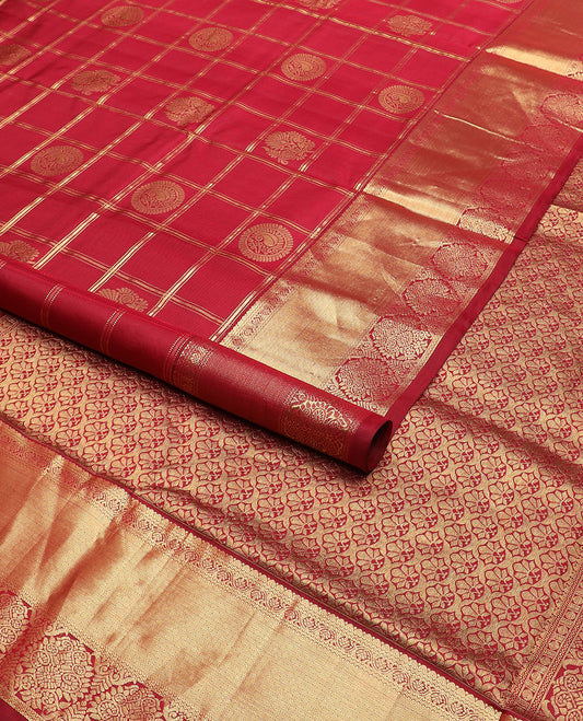 Light maroon butta enclosed checked nine-yard silk saree, traditional zari border, and pallu of intricate designs