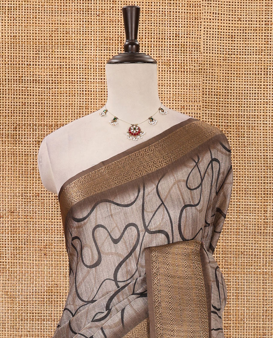 Chikku geometric printed semi-jute saree, contrast geometric zari border, Madhubani-style printed pallu, & brown blouse of print & zari work