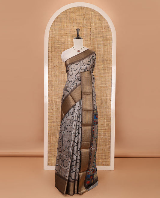 Chikku geometric printed semi-jute saree, contrast geometric zari border, Madhubani-style printed pallu, & brown blouse of print & zari work