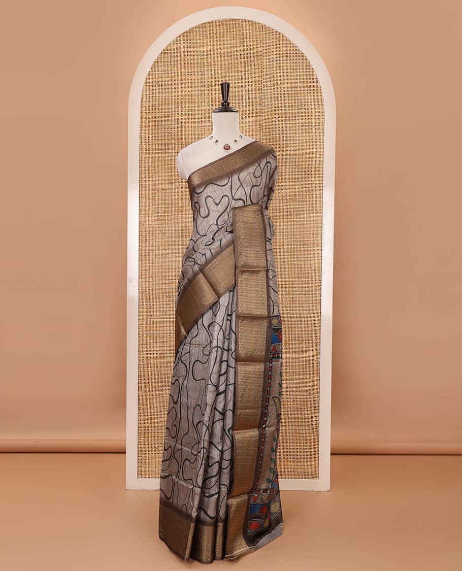 Chikku geometric printed semi-jute saree, contrast geometric zari border, Madhubani-style printed pallu, & brown blouse of print & zari work