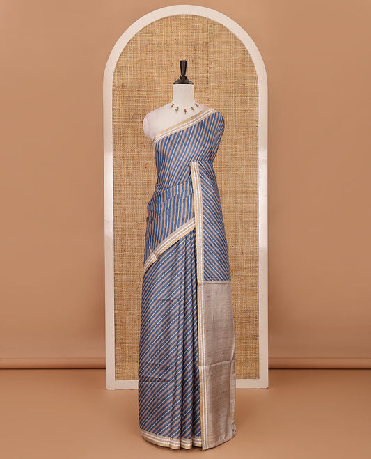 Blue lehariya-style striped semi-tussar saree, contrast resham thread triangle motifs border, diamond printed pallu & contrast printed blouse
