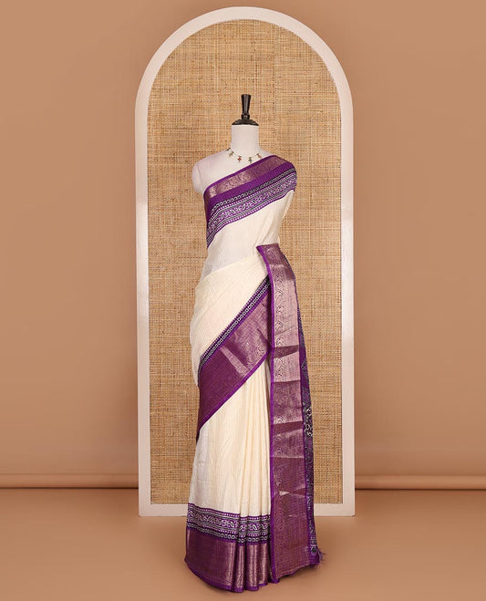 Cream-violet zari striped dola silk saree, contrast traditional zari border of leaf creeper, Ajrakh printed pallu, and Ajrakh printed blouse