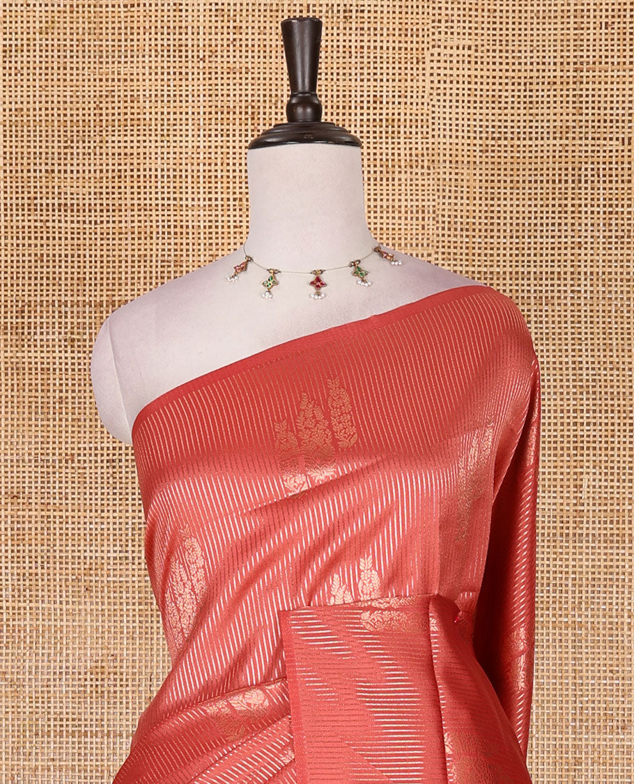 Borderless peach stripes and zari floral buttas elite soft silk saree, contrast ogee patterned zari pallu, and contrast zari design blouse