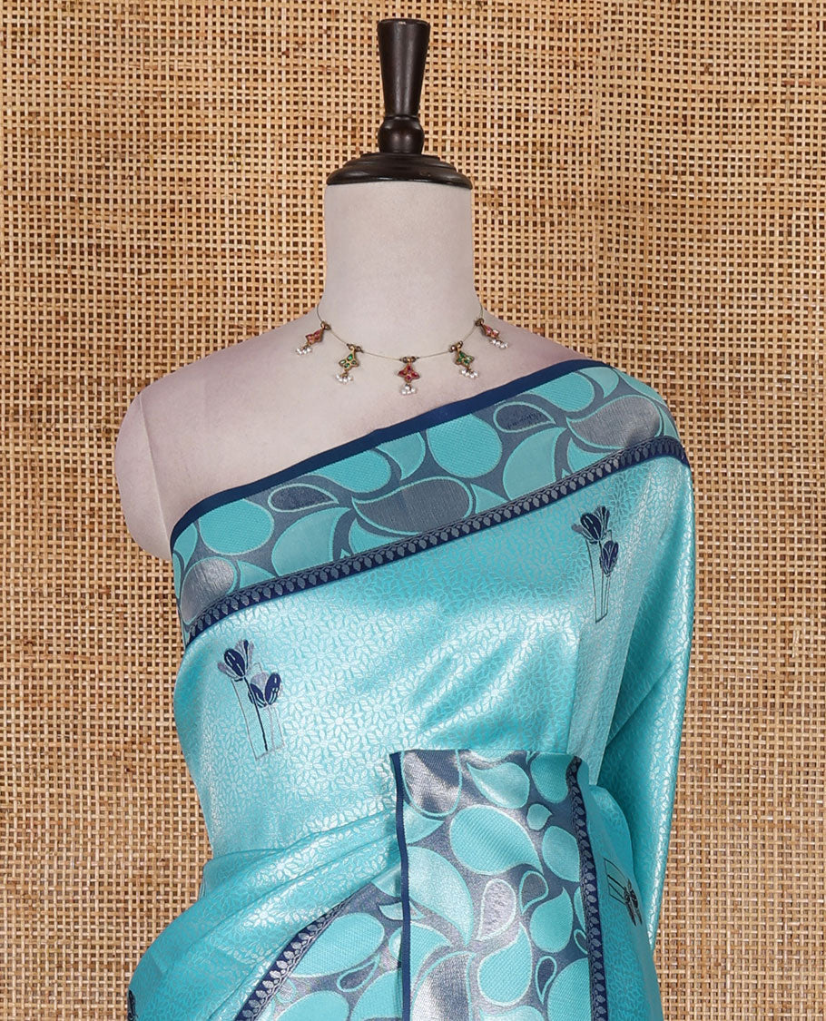 Blue jacquard kanchi silk saree, contrast border, and pallu steeped with paisley motifs with contrast zari design blouse