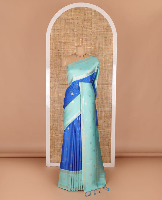 Blue zari buttas soft silk saree, contrast zari border of intricate designs, zari-rich jaal pallu, and a contrast zari design blouse